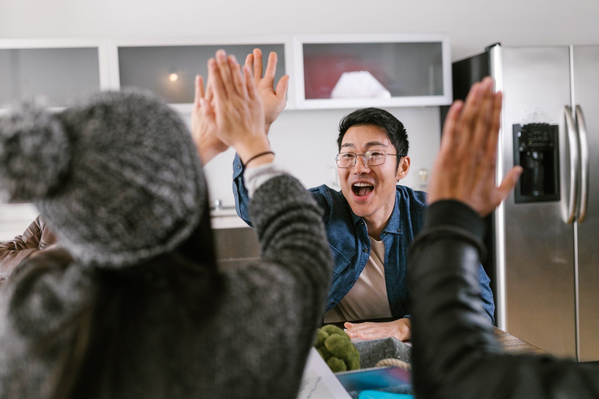 High-five celebration at a business meeting
